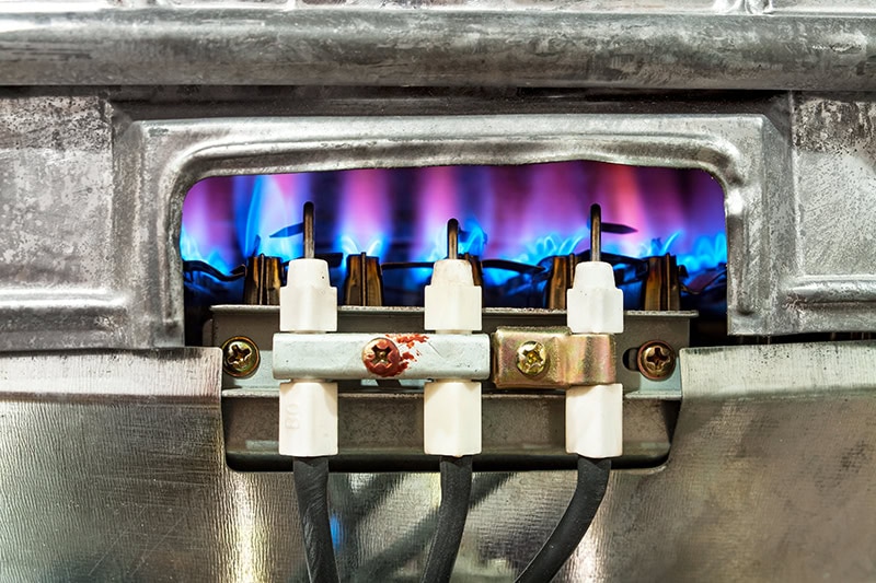 close-up of a furnace pilot flame.