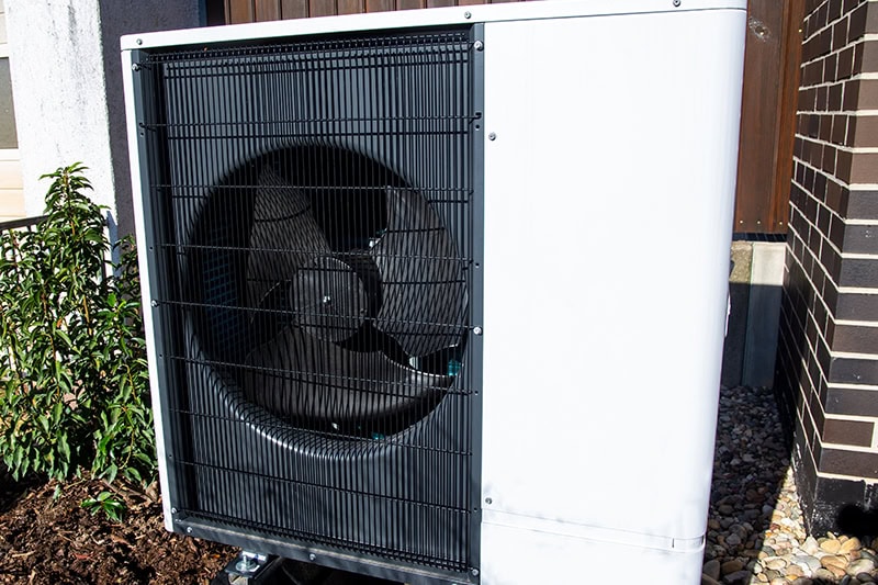 Air and water heat pump on a residential home.